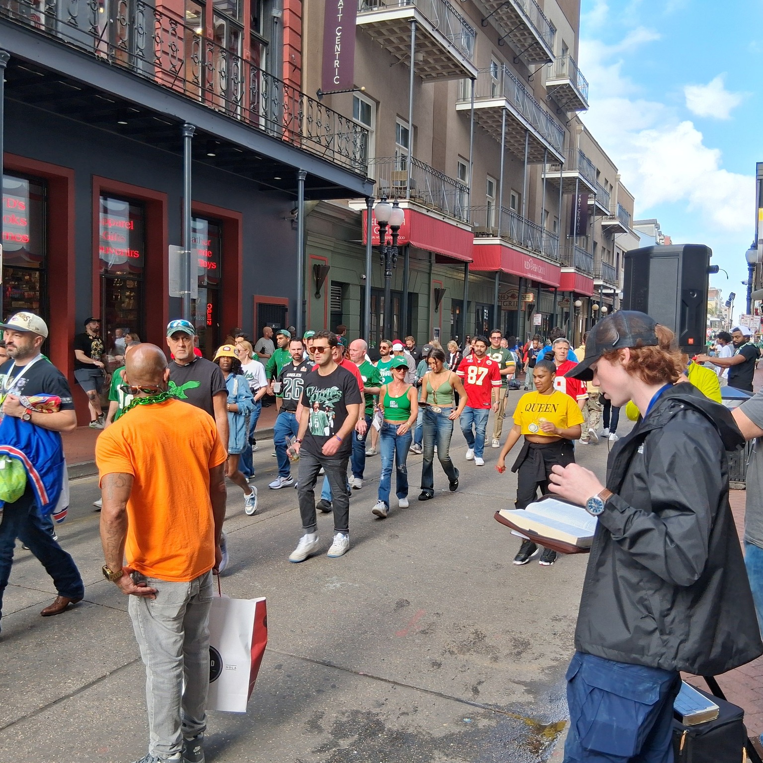 Sharing Scripture during Gospel outreach in a New Orleans crowd