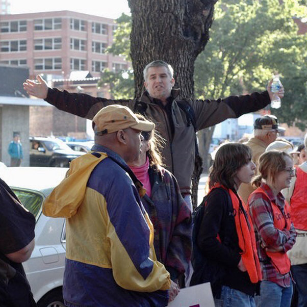 Open-air Gospel preaching in a public gathering